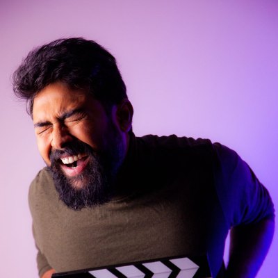 An actor mid-take with a clapperboard