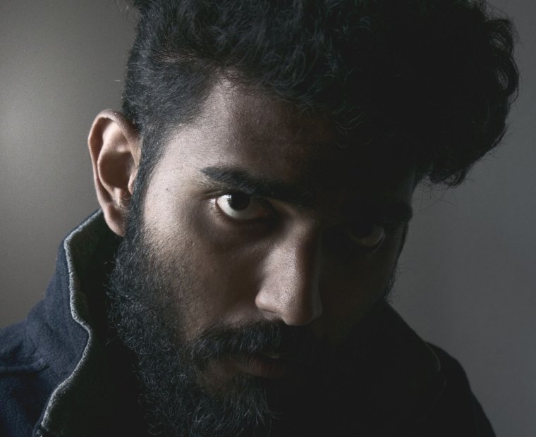 An actor holding the camera in close-up